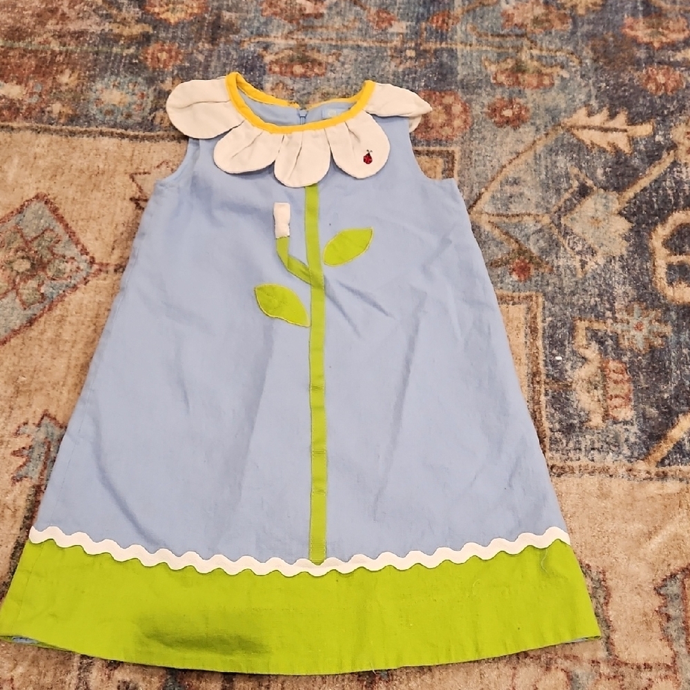 a Girl Cute Blue Dress with Flower Design